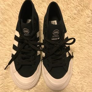 Adidas canvas mid rise 3 stripe tennis shoes.